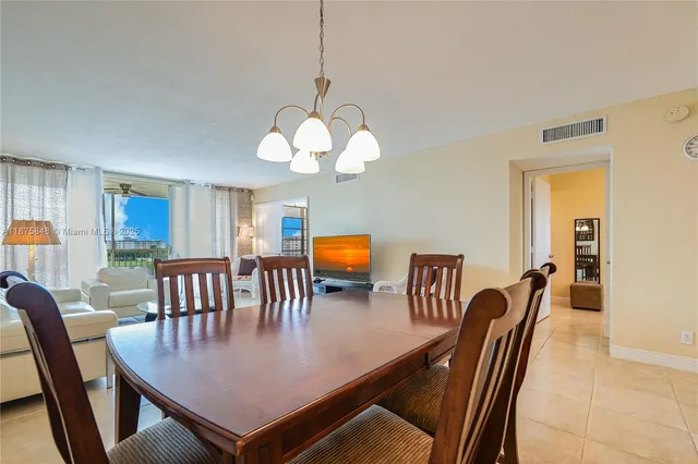a view of a dining room and a livingroom with furniture