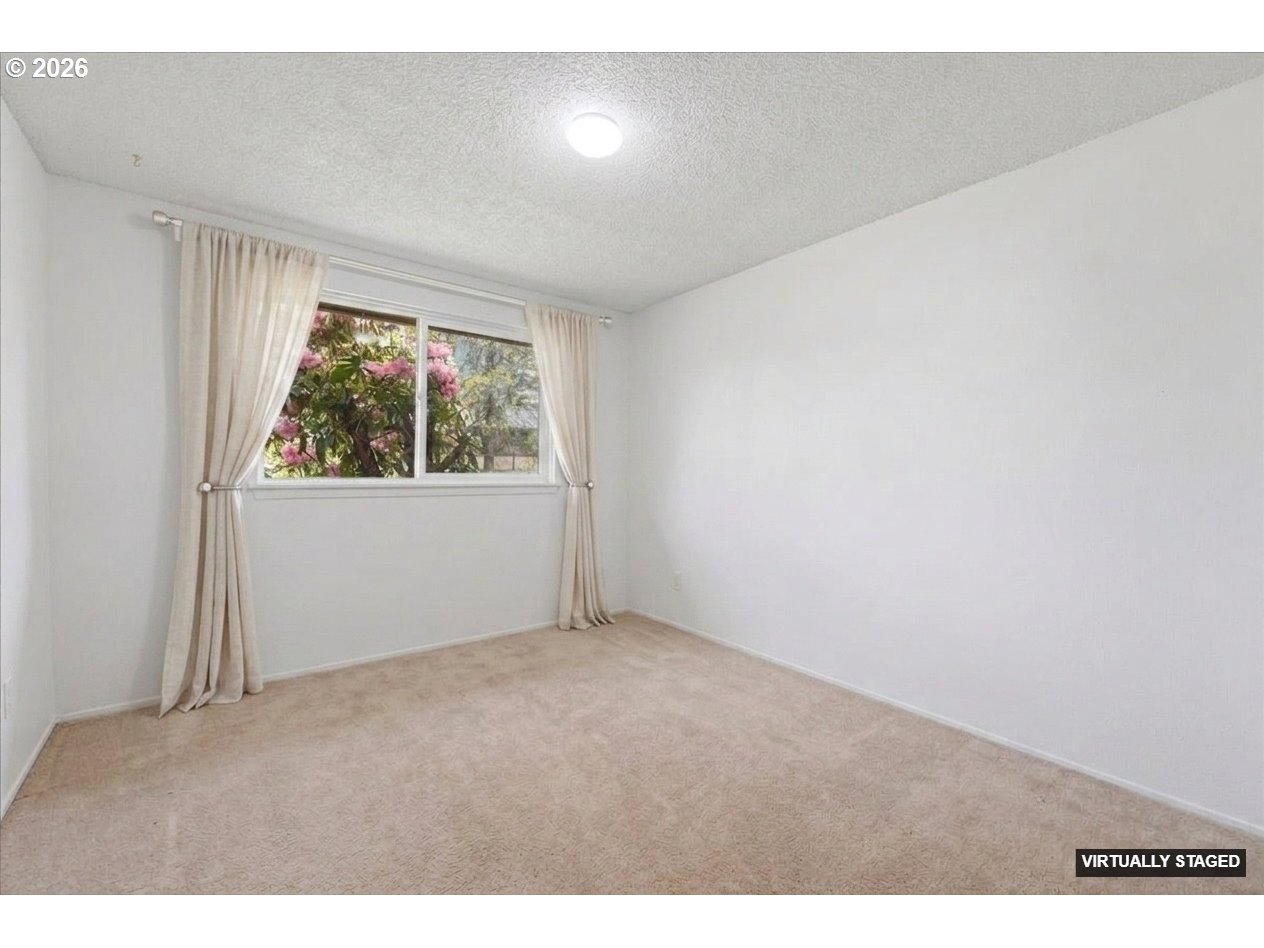 892 Northeast 28th Street Gresham, OR 97030 - Photo 16 of 24 an empty room with windows