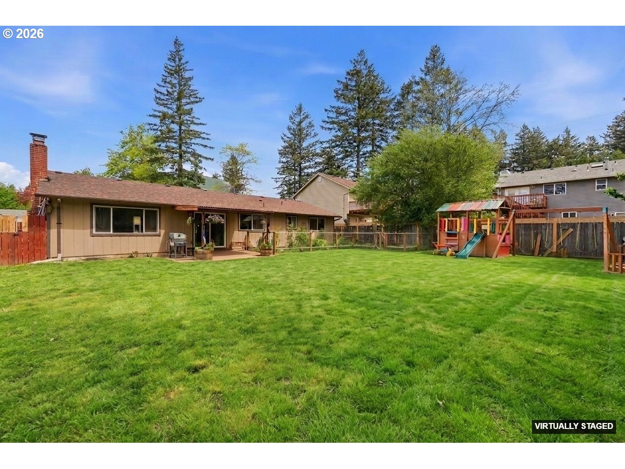 892 Northeast 28th Street Gresham, OR 97030 - Photo 21 of 24 a view of a house with a yard porch and sitting area