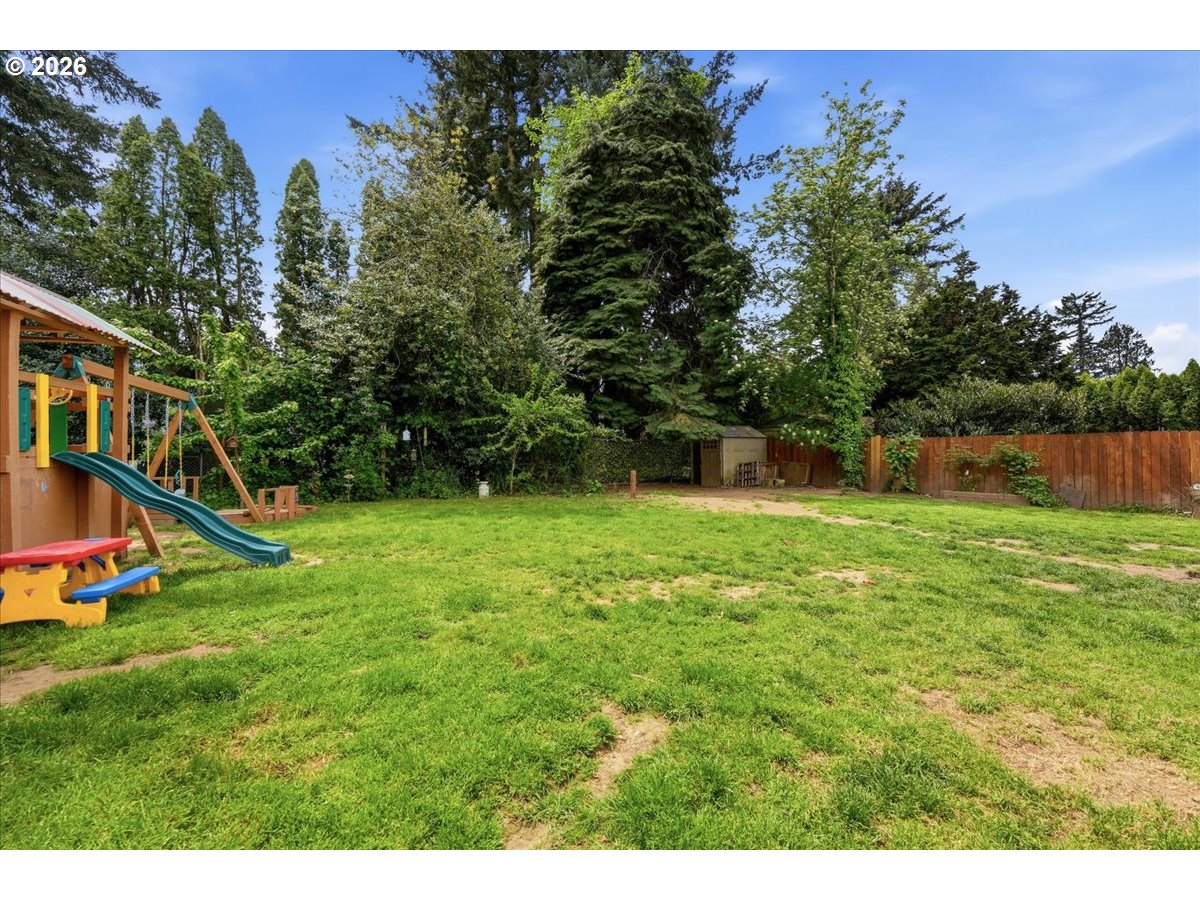 892 Northeast 28th Street Gresham, OR 97030 - Photo 22 of 24 a view of a house with a yard porch and a tree