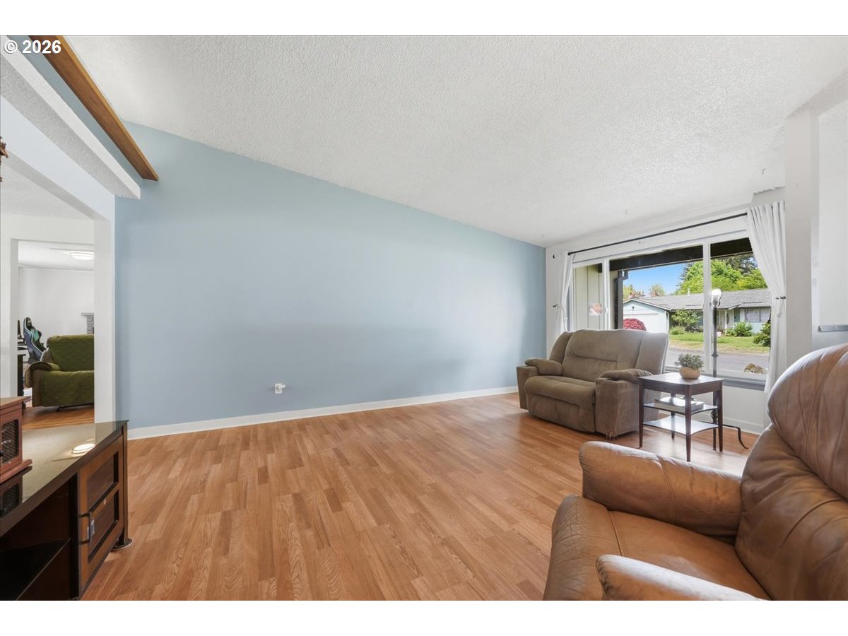 892 Northeast 28th Street Gresham, OR 97030 - Photo 5 of 24 a living room with furniture and a large window