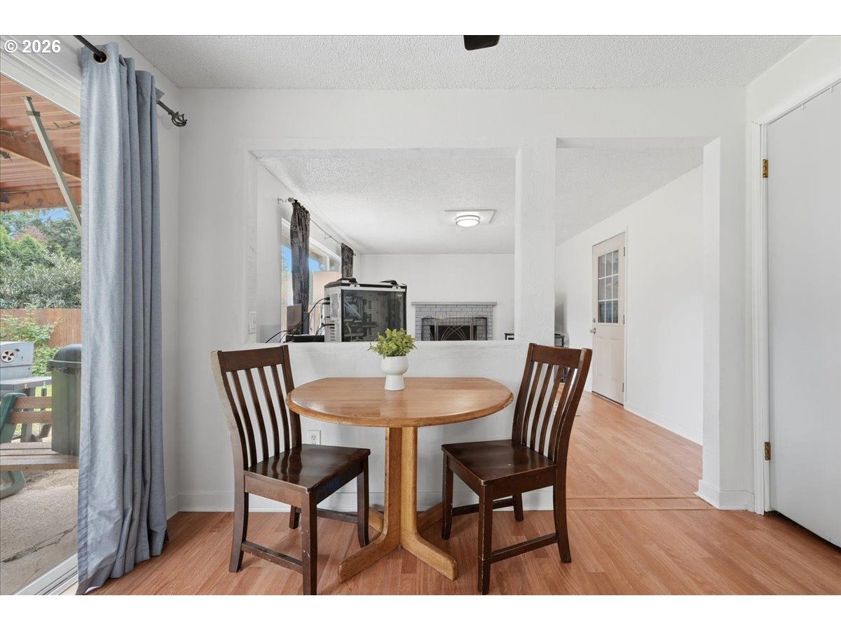 892 Northeast 28th Street Gresham, OR 97030 - Photo 6 of 24 a view of a dining room with furniture and wooden floor
