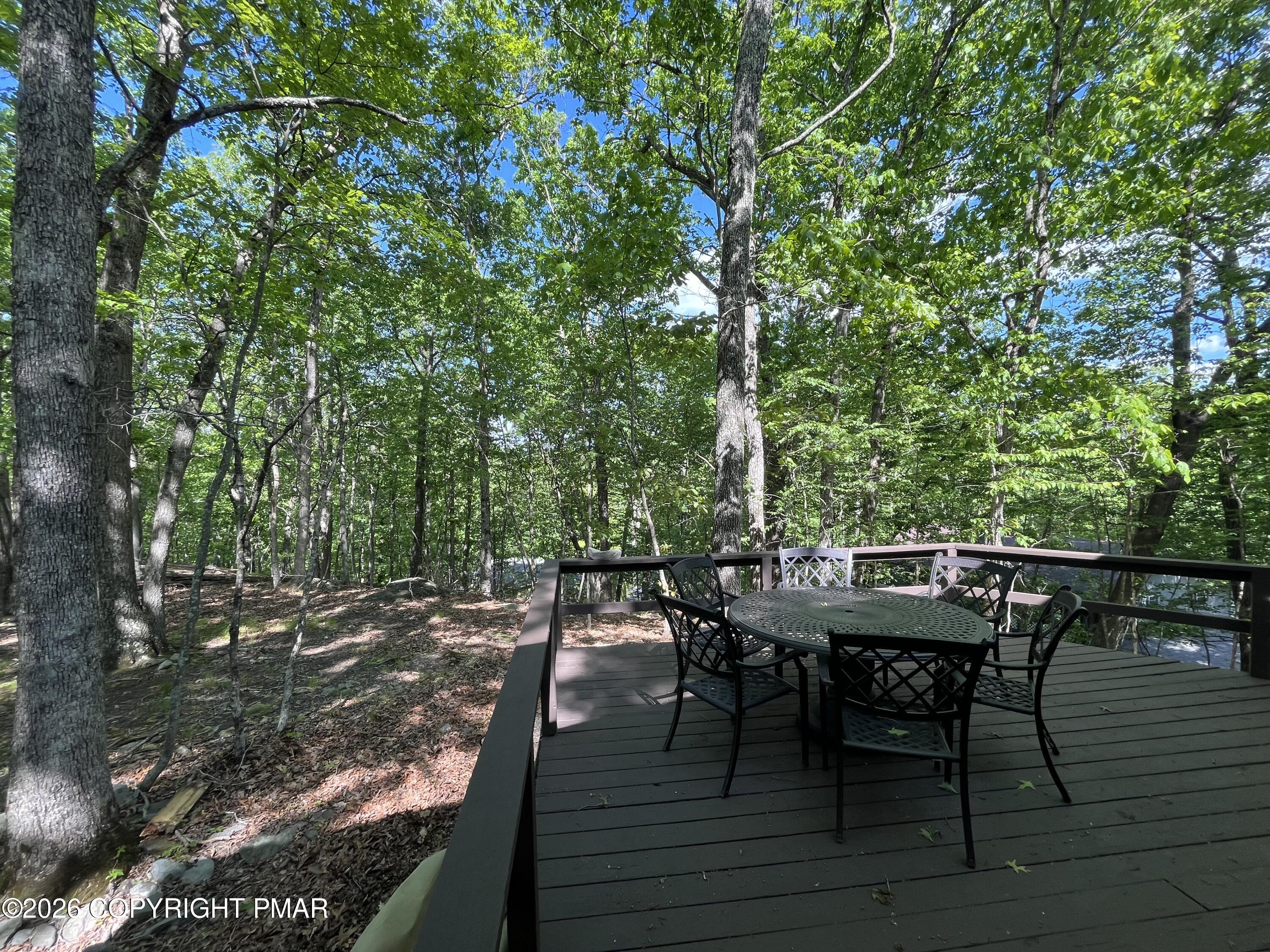 5970 Decker Road Bushkill, PA 18324 - Photo 10 of 26 a view of a dinning table and chairs in patio