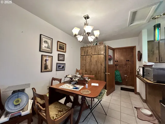a kitchen with a sink a stove cabinets and a window