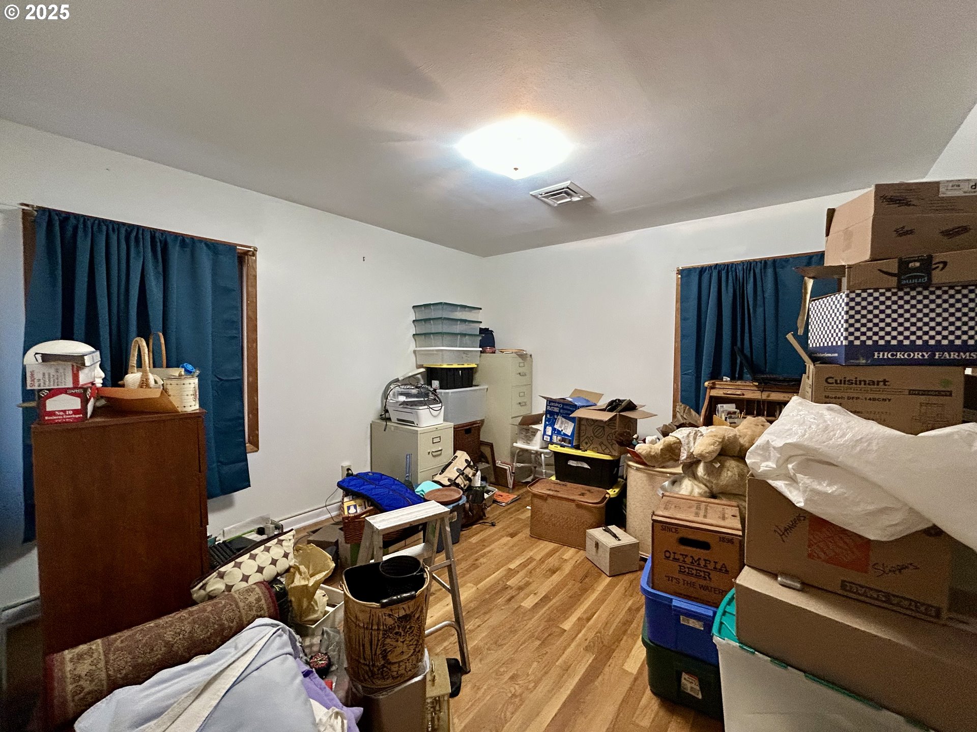 917 Myrtle Street The Dalles, OR 97058 - Photo 16 of 22 a living room with furniture a rug and a closet