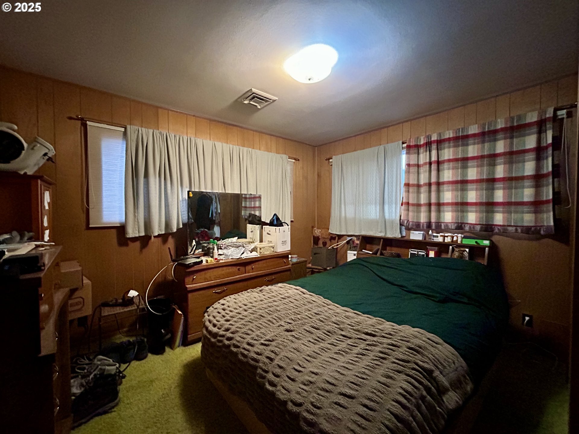 917 Myrtle Street The Dalles, OR 97058 - Photo 18 of 22 a bedroom with a bed and a television