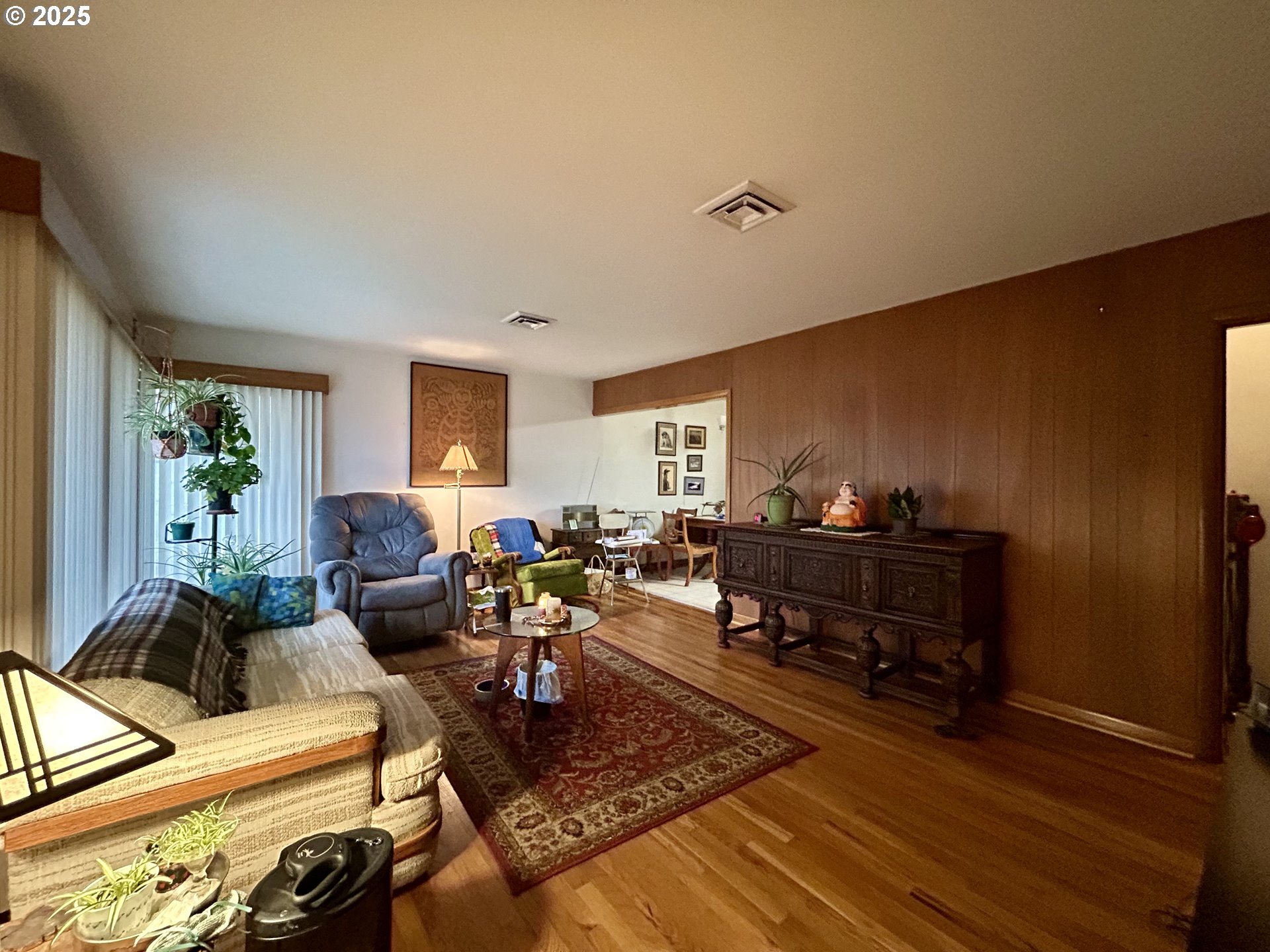 917 Myrtle Street The Dalles, OR 97058 - Photo 10 of 22 a living room with furniture and a wooden floor