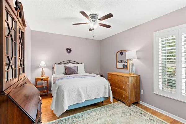 a bedroom with bed and window