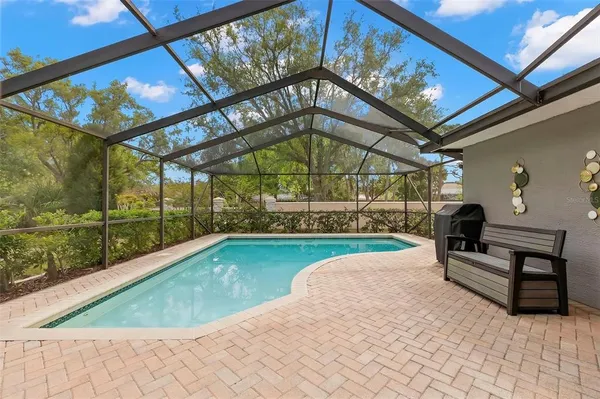 a view of swimming pool with a patio