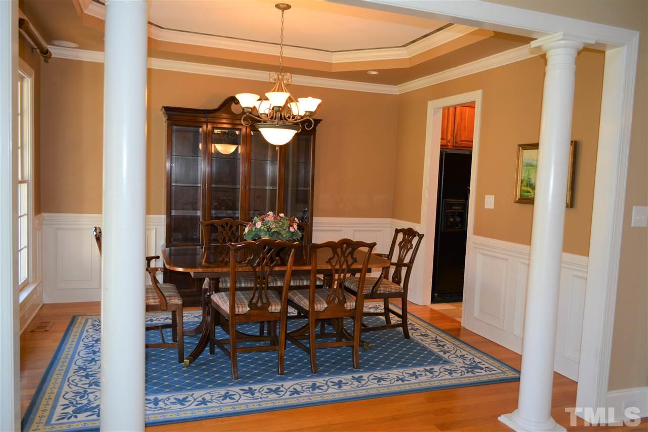 1316 Wynncrest Court Raleigh, NC 27603 - Photo 15 of 30 a view of a dining room with furniture and chandelier