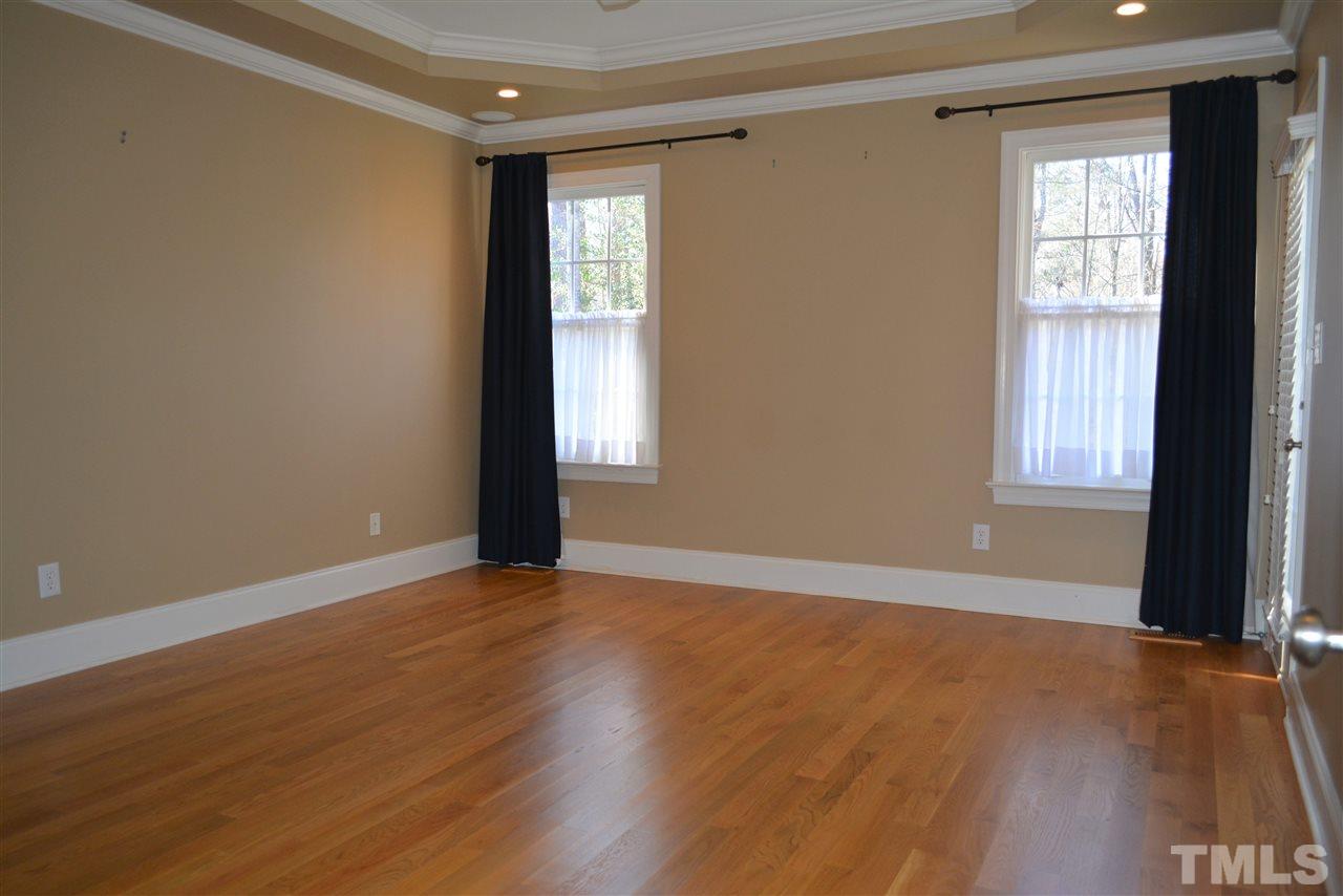 1316 Wynncrest Court Raleigh, NC 27603 - Photo 16 of 30 a view of an empty room with wooden floor and a window