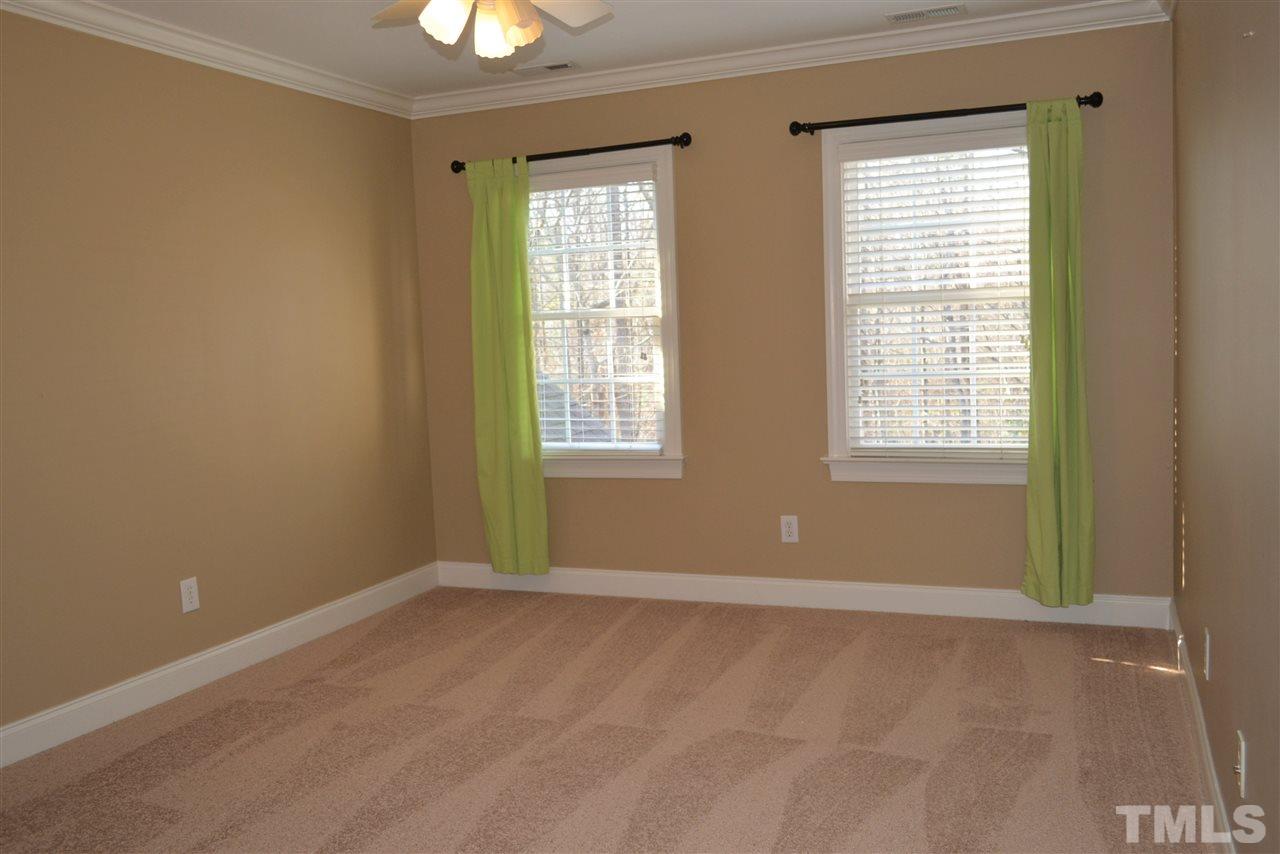 1316 Wynncrest Court Raleigh, NC 27603 - Photo 19 of 30 a view of an empty room with a window and a chandelier