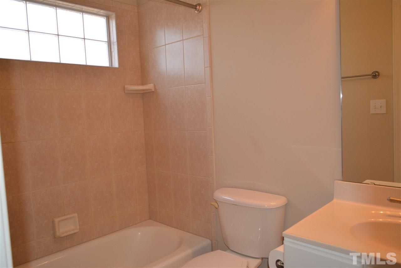 1316 Wynncrest Court Raleigh, NC 27603 - Photo 21 of 30 a bathroom with a toilet and a sink