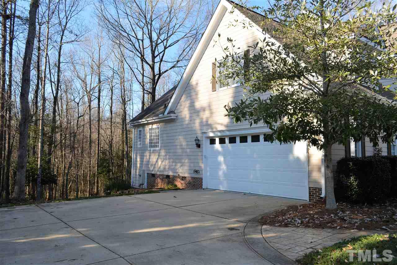 1316 Wynncrest Court Raleigh, NC 27603 - Photo 29 of 30 a front view of a house with a yard and garage