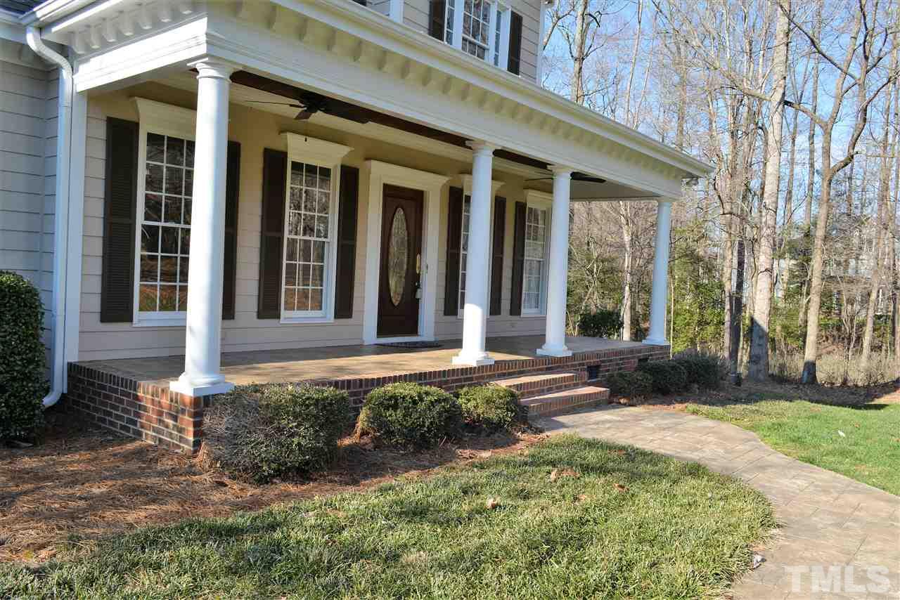 1316 Wynncrest Court Raleigh, NC 27603 - Photo 4 of 30 front view of a brick house with a yard