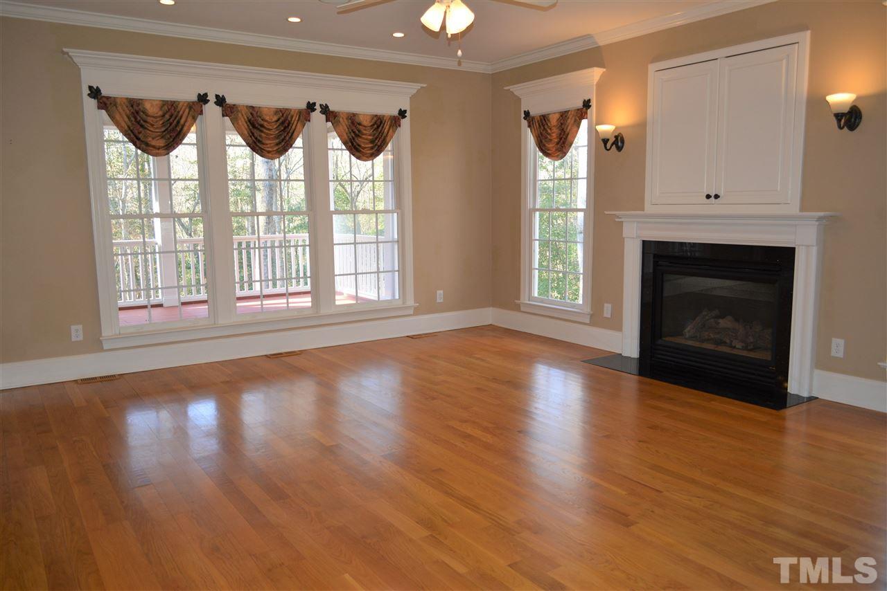 1316 Wynncrest Court Raleigh, NC 27603 - Photo 6 of 30 a view of an empty room with wooden floor and a window