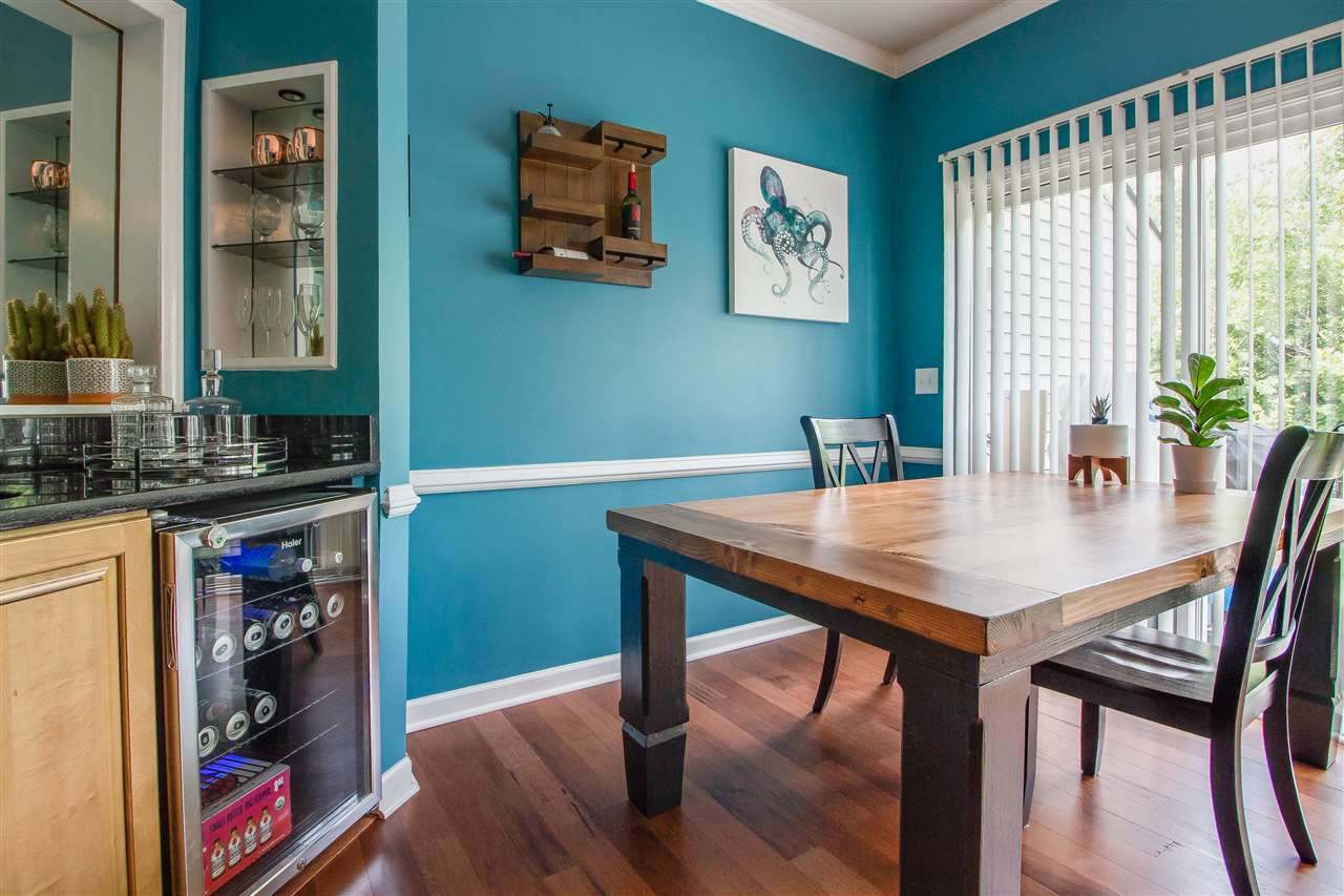 5022 Echo Ridge Road Raleigh, NC 27612 - Photo 11 of 22 a view of a dining room with furniture and window