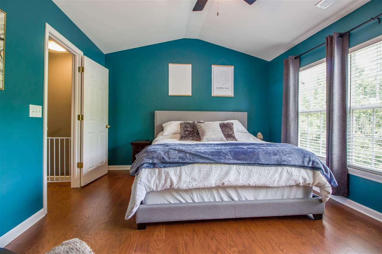 5022 Echo Ridge Road Raleigh, NC 27612 - Photo 13 of 22 a bedroom with a bed and window