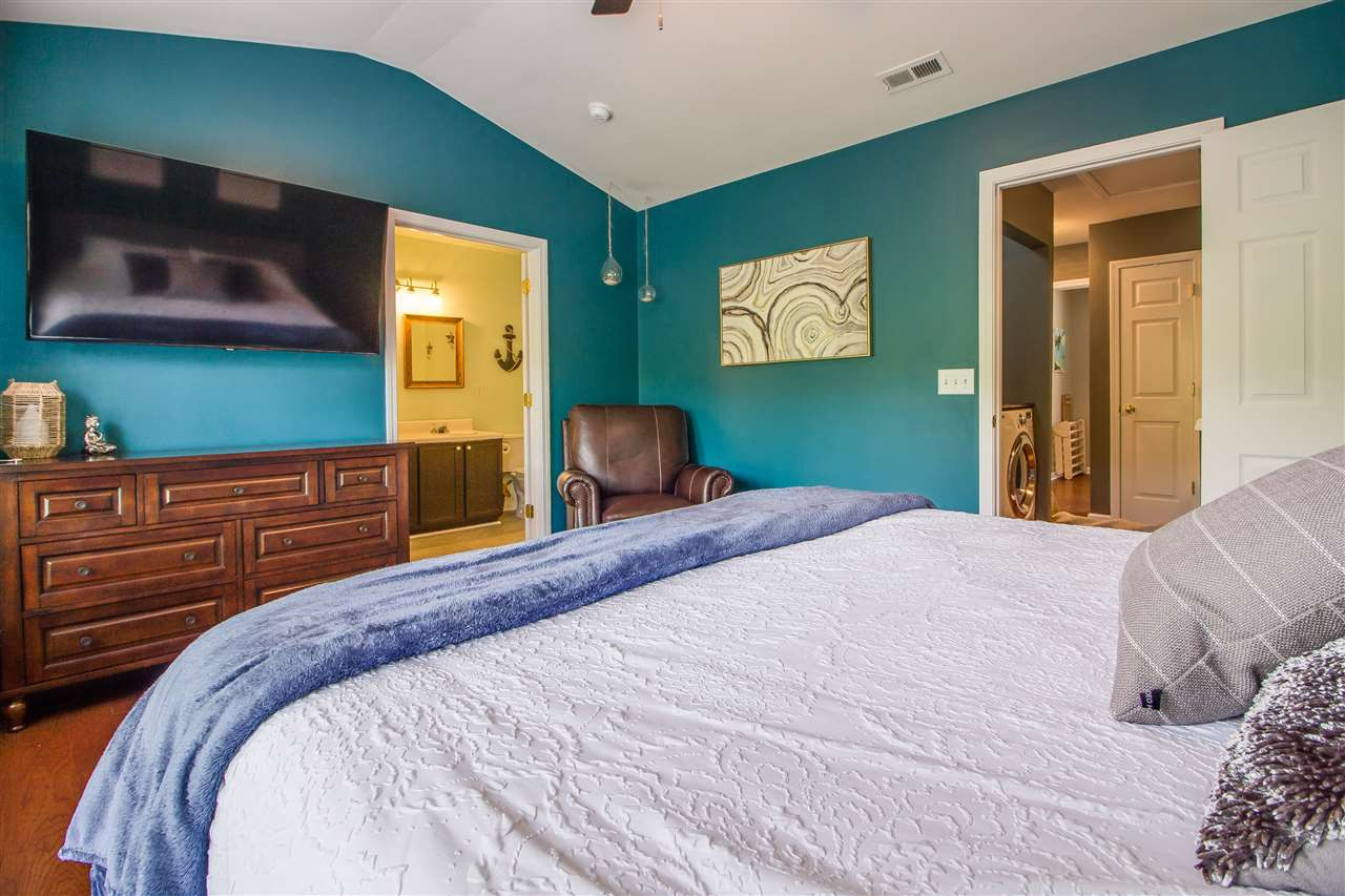 5022 Echo Ridge Road Raleigh, NC 27612 - Photo 14 of 22 a bedroom with a bed and furniture