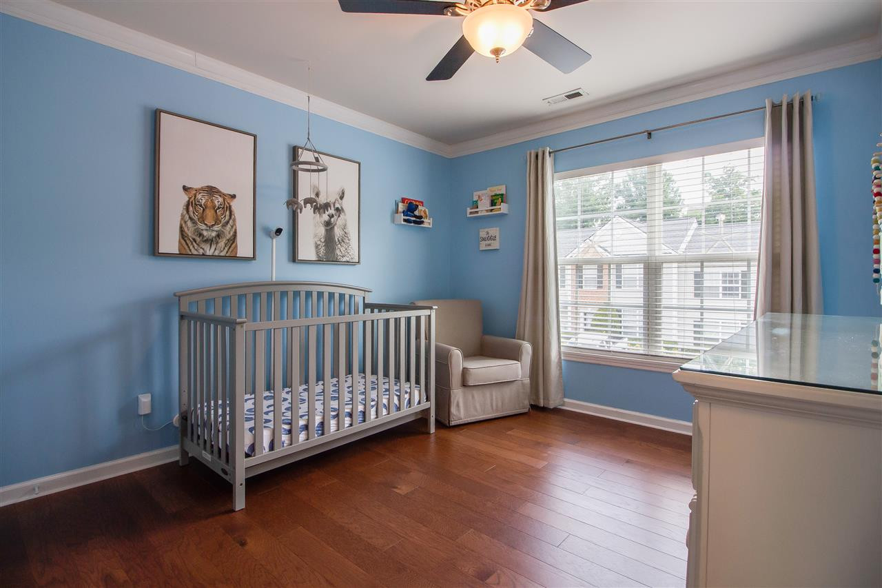 5022 Echo Ridge Road Raleigh, NC 27612 - Photo 16 of 22 a view of a room with furniture window and wooden floor