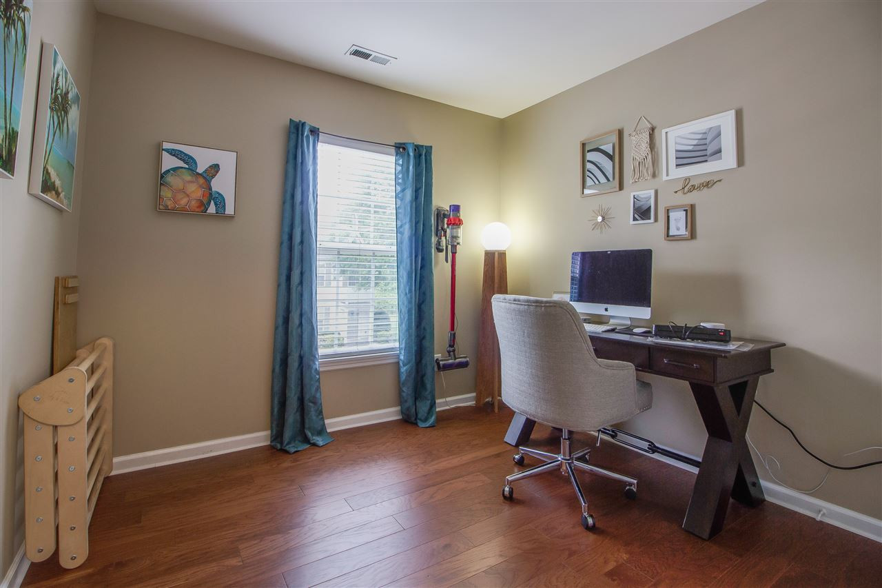 5022 Echo Ridge Road Raleigh, NC 27612 - Photo 17 of 22 a view of a workspace with furniture and a window