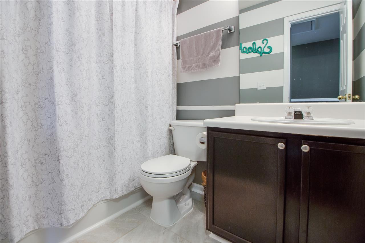 5022 Echo Ridge Road Raleigh, NC 27612 - Photo 18 of 22 a bathroom with a sink toilet and mirror