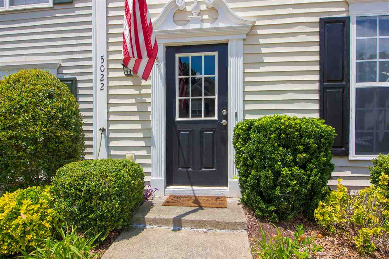 5022 Echo Ridge Road Raleigh, NC 27612 - Photo 2 of 22 a entryway with flower garden