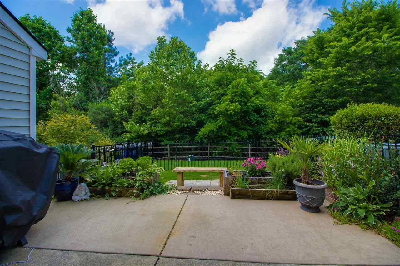 5022 Echo Ridge Road Raleigh, NC 27612 - Photo 22 of 22 a view of a garden with patio
