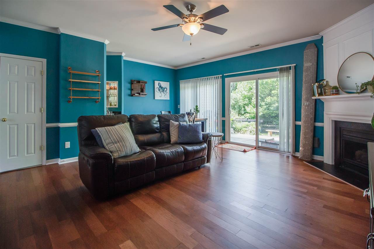 5022 Echo Ridge Road Raleigh, NC 27612 - Photo 6 of 22 a living room with furniture and a fireplace