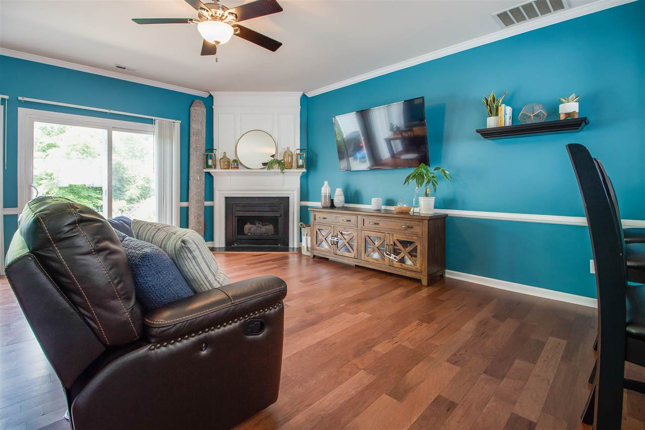 5022 Echo Ridge Road Raleigh, NC 27612 - Photo 8 of 22 a living room with furniture and a fireplace