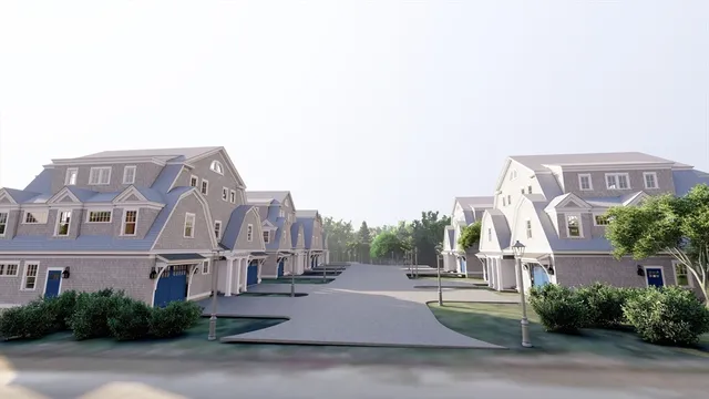 an aerial view of a house with garden space and a street view