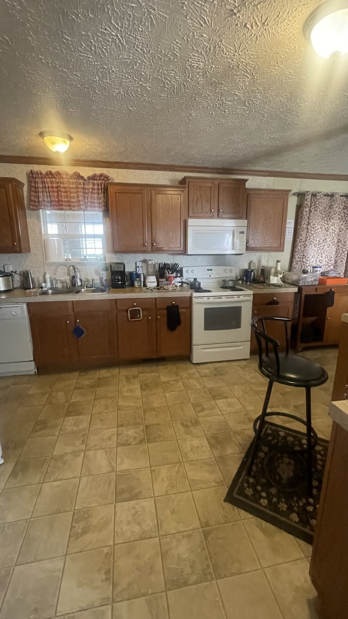 75 Snell Road Ethridge, TN 38456 - Photo 14 of 51 a kitchen with stainless steel appliances granite countertop a stove a sink and a microwave