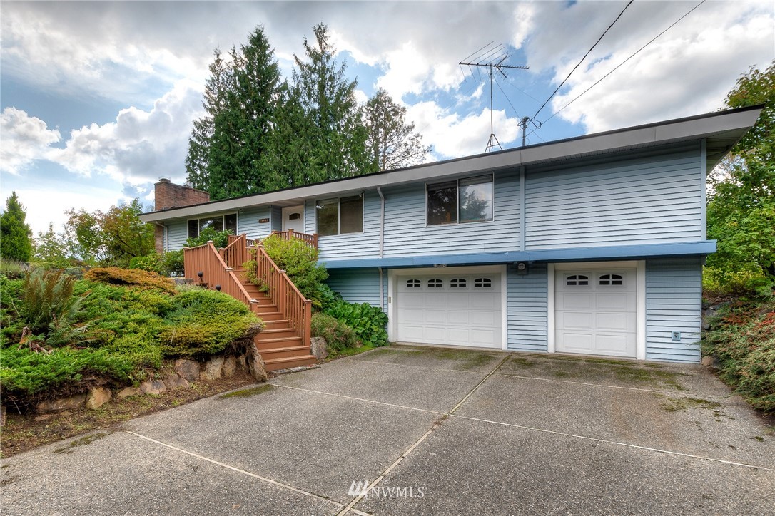 13453 Patriot Way Renton, WA 98059 - Photo 1 of 25 a front view of a house with garden