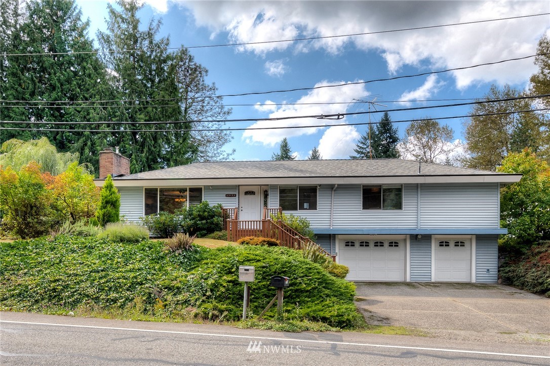 13453 Patriot Way Renton, WA 98059 - Photo 2 of 25 a front view of a house with garden