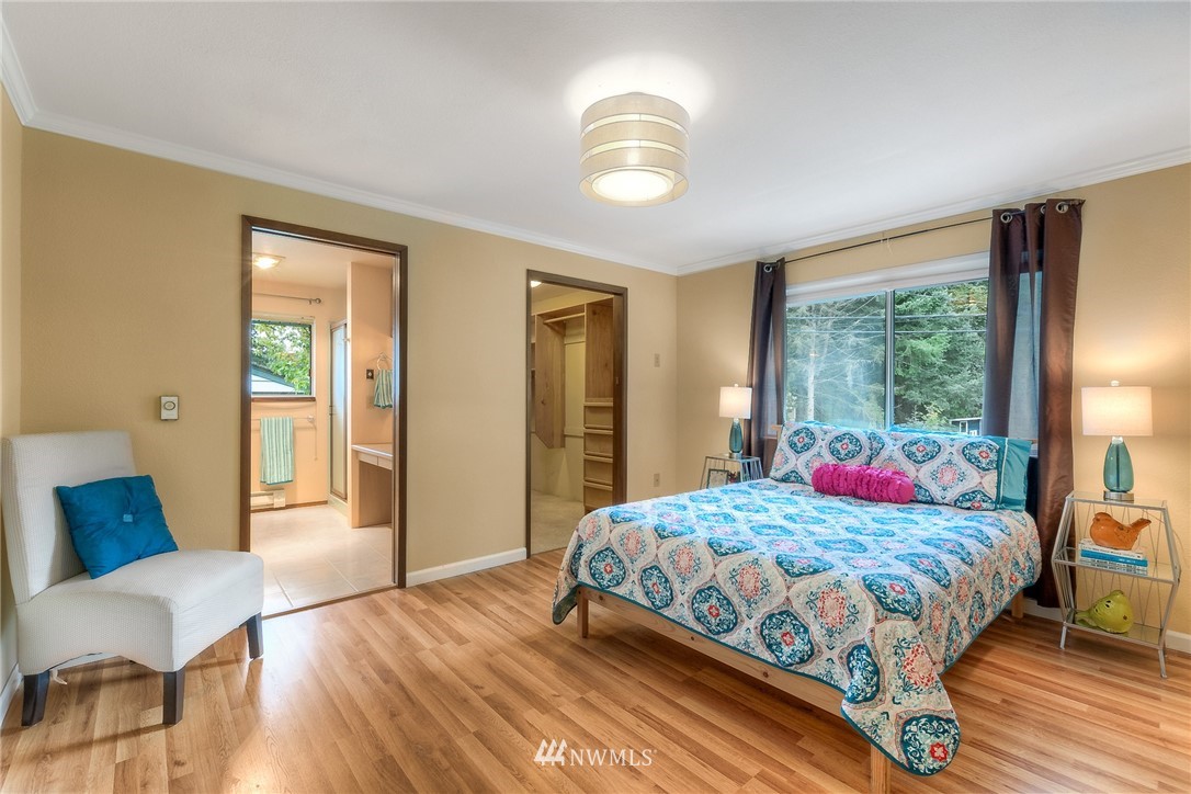 13453 Patriot Way Renton, WA 98059 - Photo 11 of 25 a bedroom with a bed and a large window