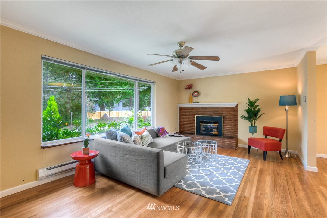 13453 Patriot Way Renton, WA 98059 - Photo 3 of 25 a living room with furniture and a fireplace