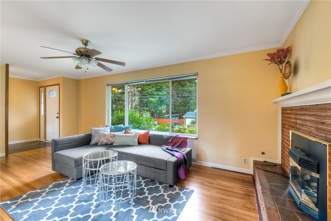 13453 Patriot Way Renton, WA 98059 - Photo 5 of 25 a living room with furniture and a fireplace