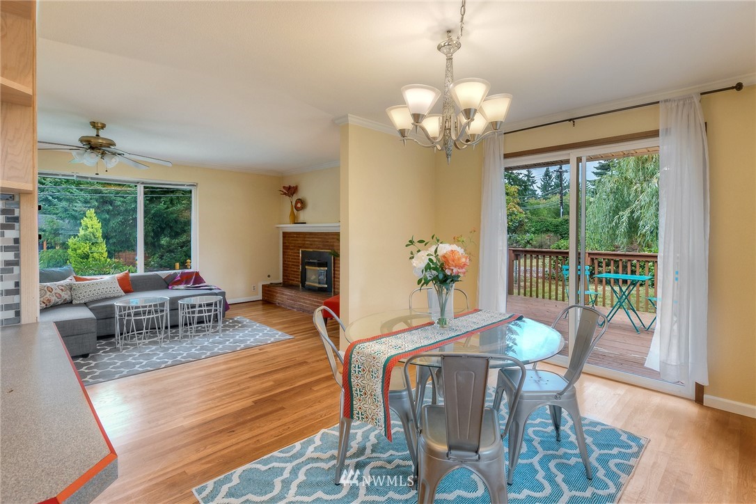 13453 Patriot Way Renton, WA 98059 - Photo 7 of 25 a view of a dining room with furniture window and wooden floor