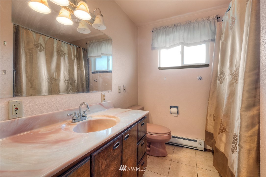 13453 Patriot Way Renton, WA 98059 - Photo 10 of 25 a bathroom with a sink a toilet and mirror