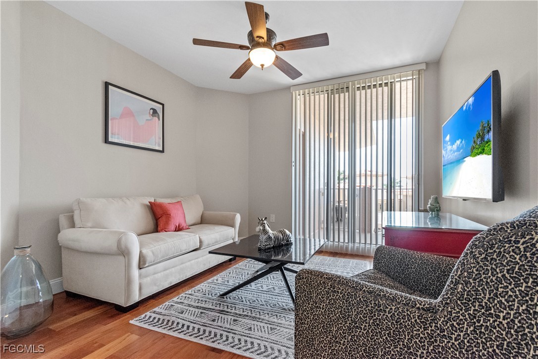 2090 West First Street, Unit I409 Fort Myers, FL 33901 - Photo 16 of 44 a living room with furniture and a window