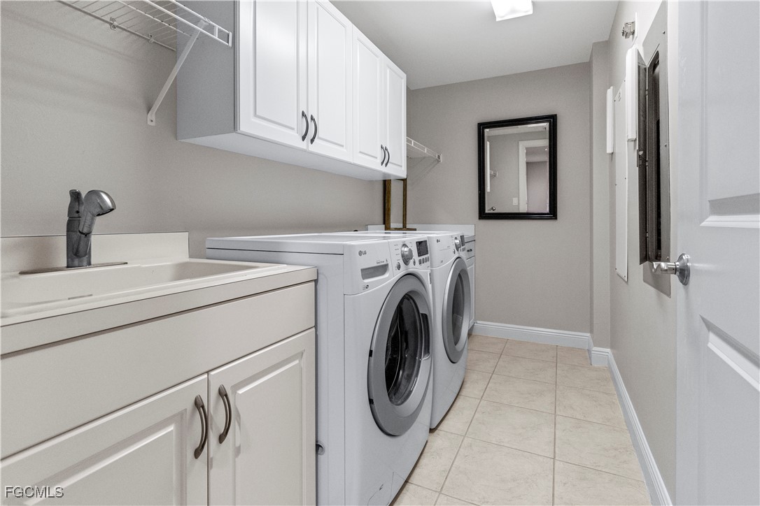 2090 West First Street, Unit I409 Fort Myers, FL 33901 - Photo 20 of 44 a utility room with dryer and washer