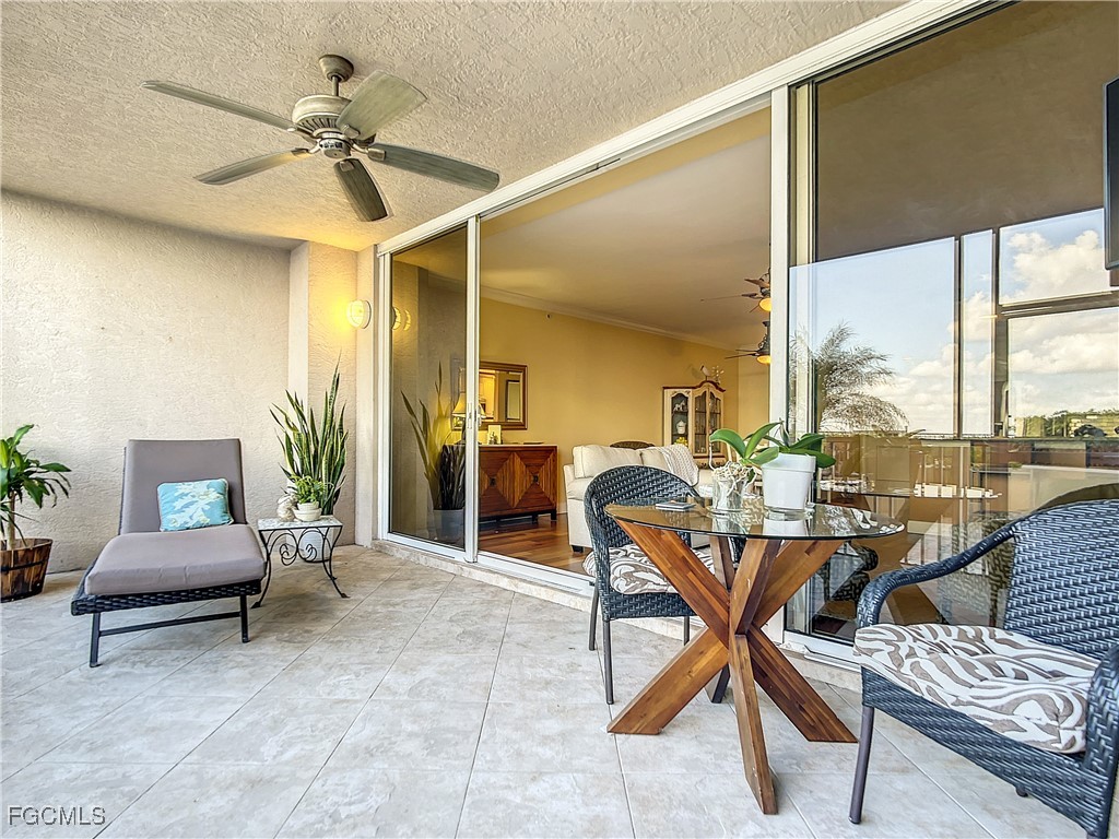 2090 West First Street, Unit I409 Fort Myers, FL 33901 - Photo 23 of 44 a workspace with wooden floor and windows