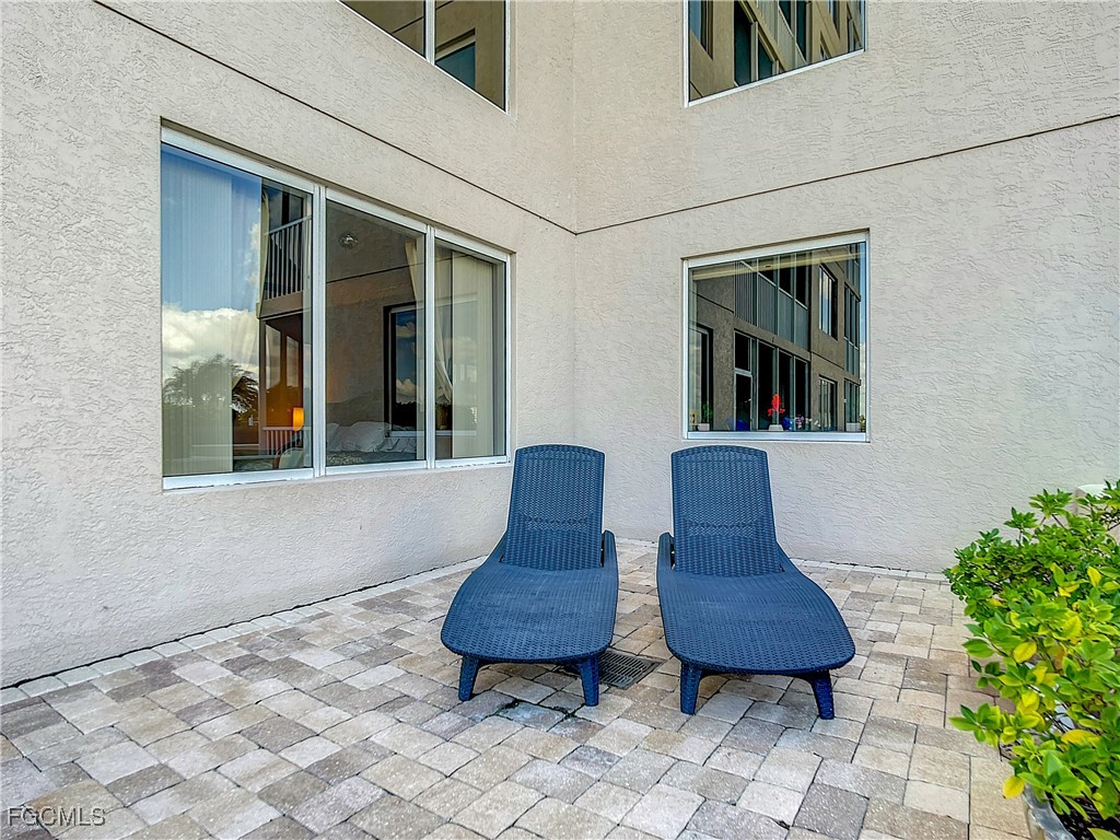2090 West First Street, Unit I409 Fort Myers, FL 33901 - Photo 30 of 44 a view of two chairs in a patio