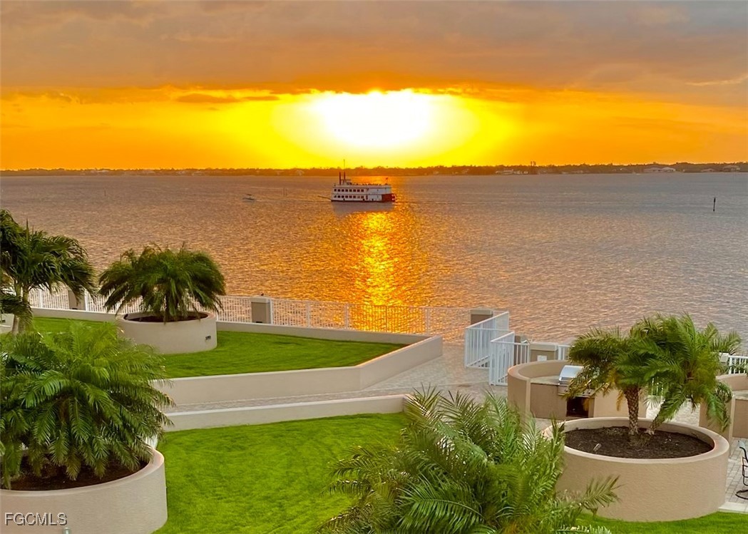 2090 West First Street, Unit I409 Fort Myers, FL 33901 - Photo 33 of 44 a view of a lake with a house in the background