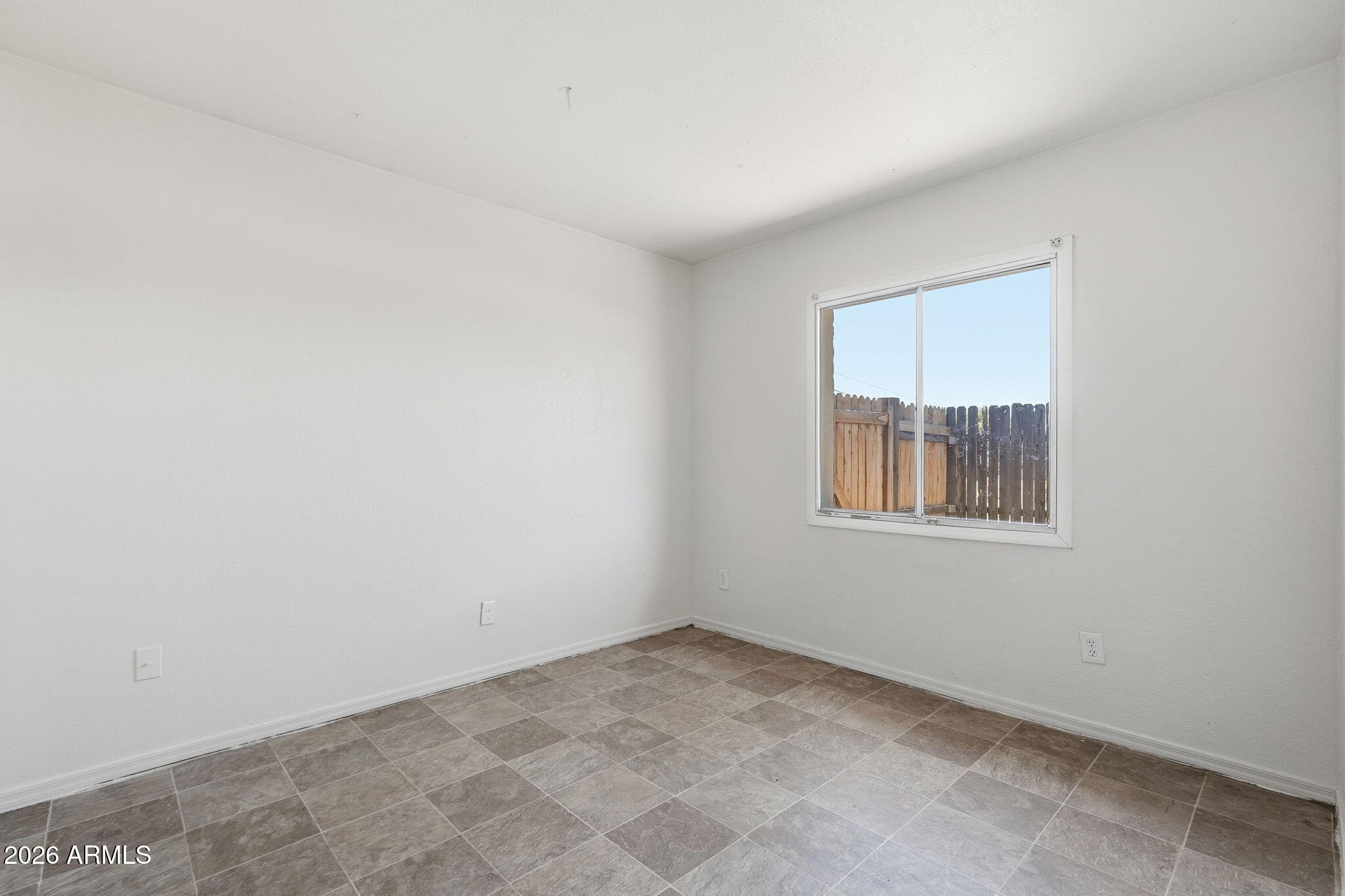 6452 West Thomas Road Phoenix, AZ 85033 - Photo 18 of 30 an empty room with a window