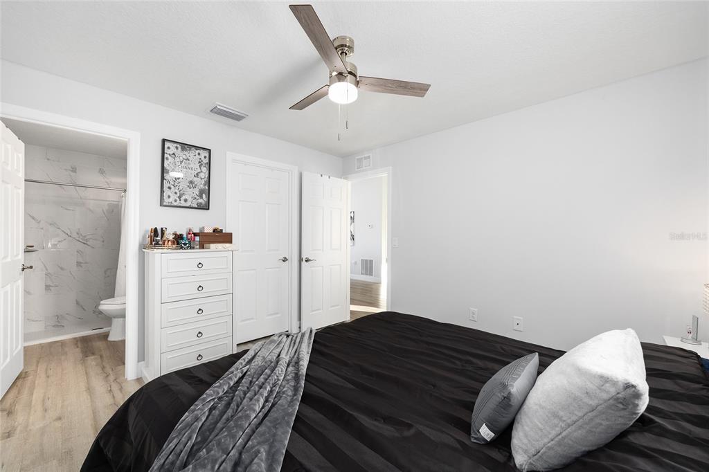 3597 Southwest 151st Avenue Ocala, FL 34481 - Photo 19 of 35 a bedroom with a bed and cabinets