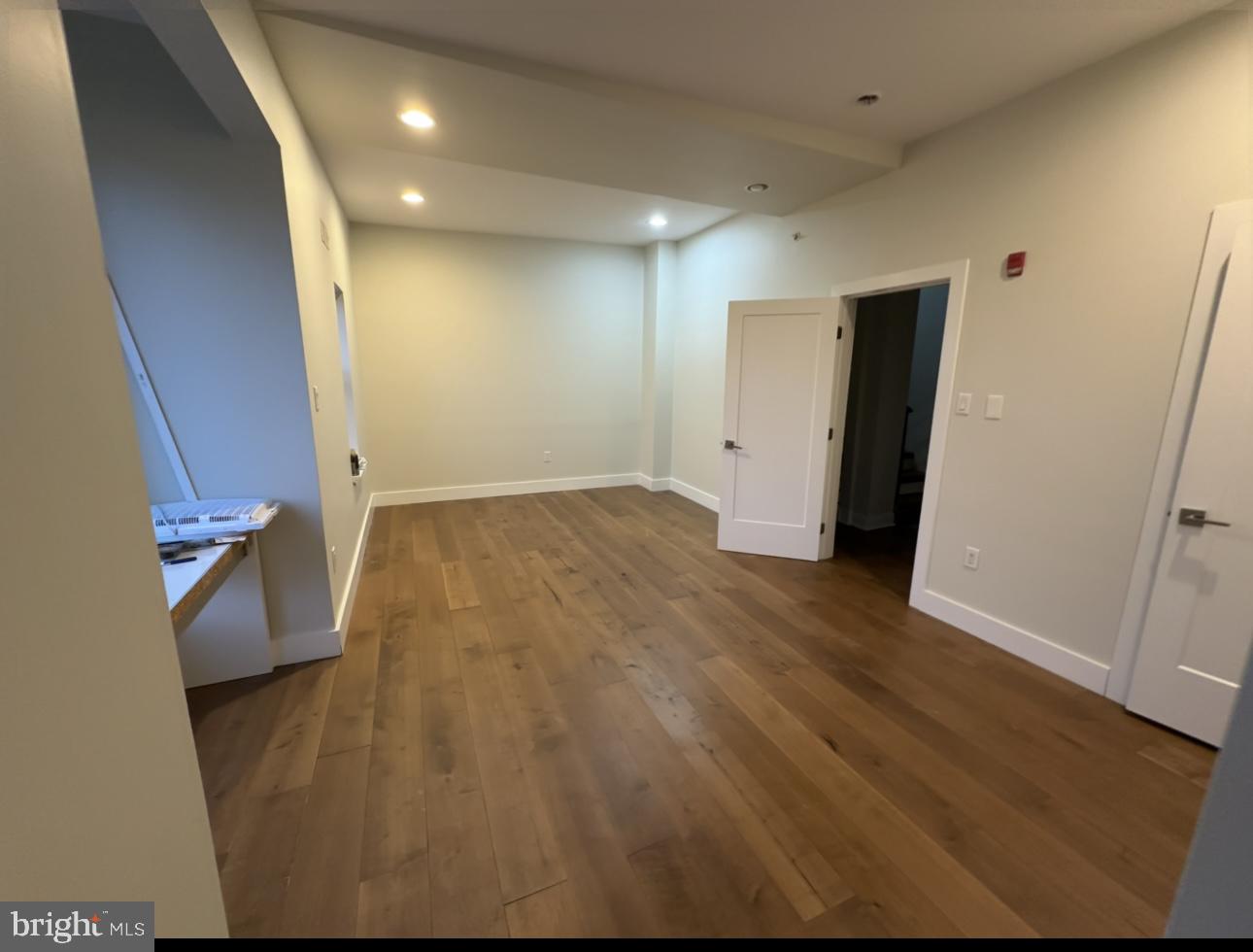819 Cameron Street, Unit 1 Philadelphia, PA 19130 - Photo 18 of 22 an empty room with wooden floor and entrance