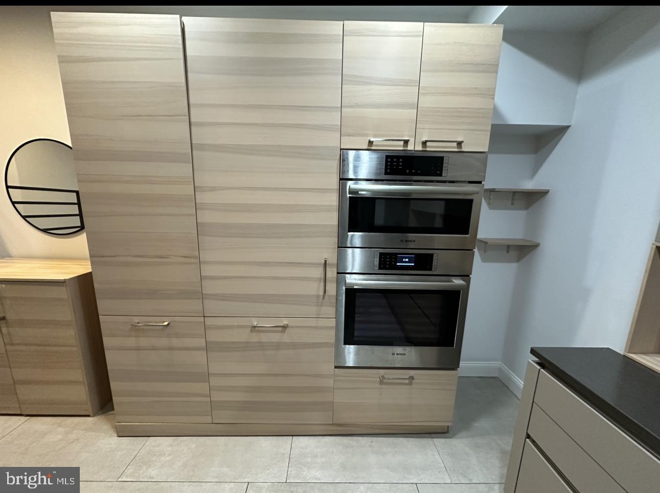 819 Cameron Street, Unit 1 Philadelphia, PA 19130 - Photo 3 of 22 a kitchen with stainless steel appliances wooden cabinets and stove