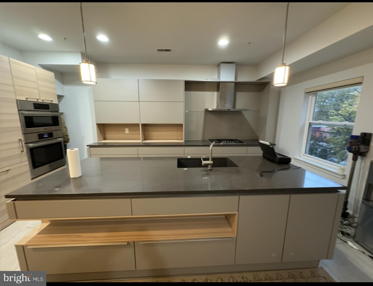 819 Cameron Street, Unit 1 Philadelphia, PA 19130 - Photo 5 of 22 a kitchen with a sink stainless steel appliances and cabinets