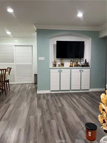 a view of closet with wooden floor